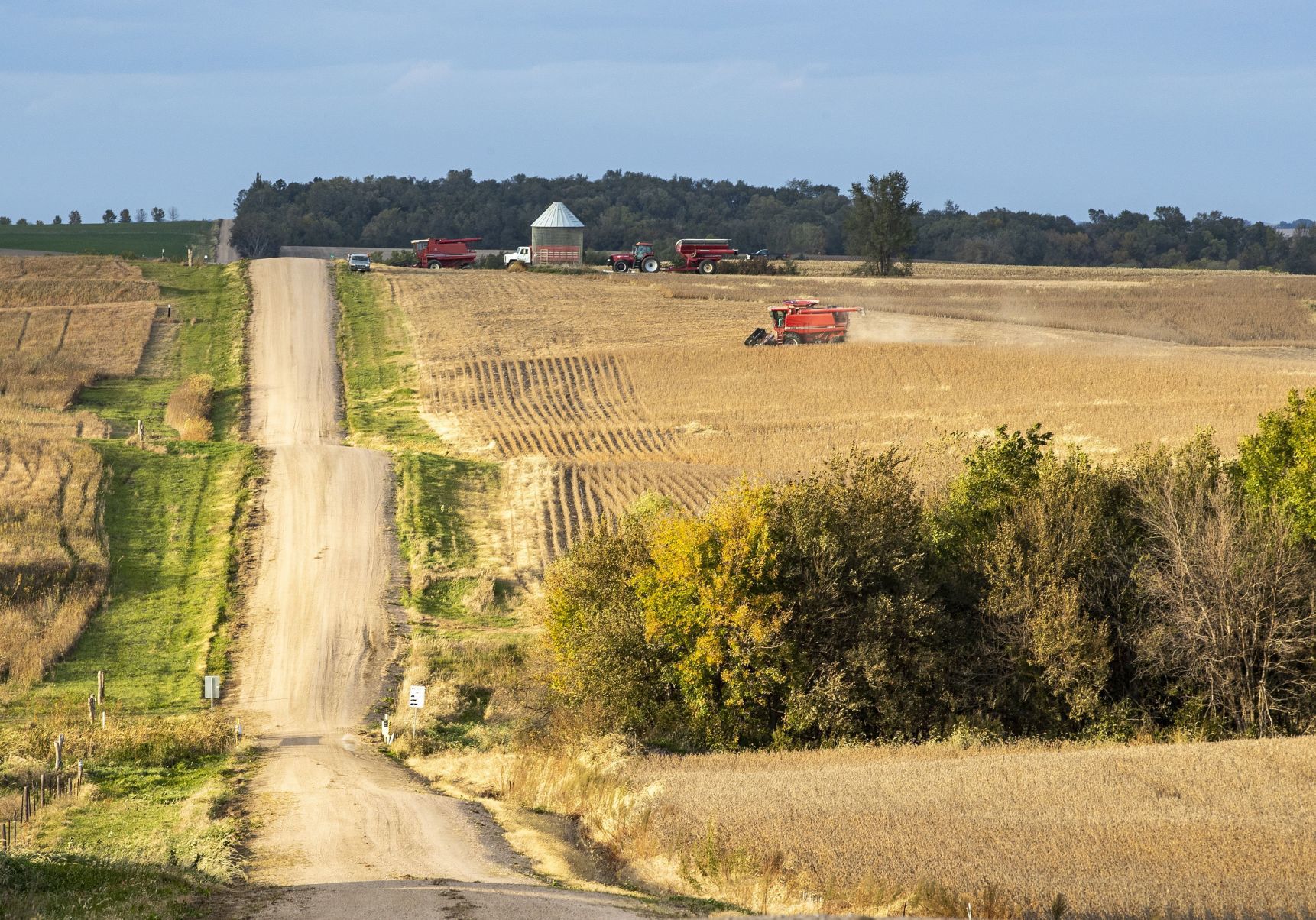 A farmer drives his combine to unload soybeans for transport near Ceresco, Nebraska.
